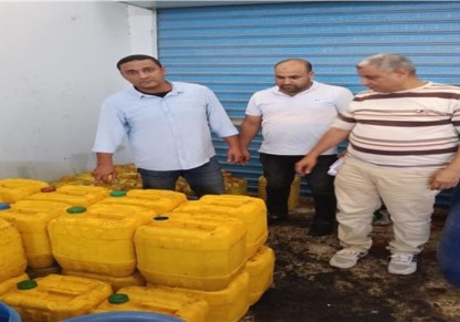 ضبط دقيق فاسد وزيوت مجهولة بالإسكندرية